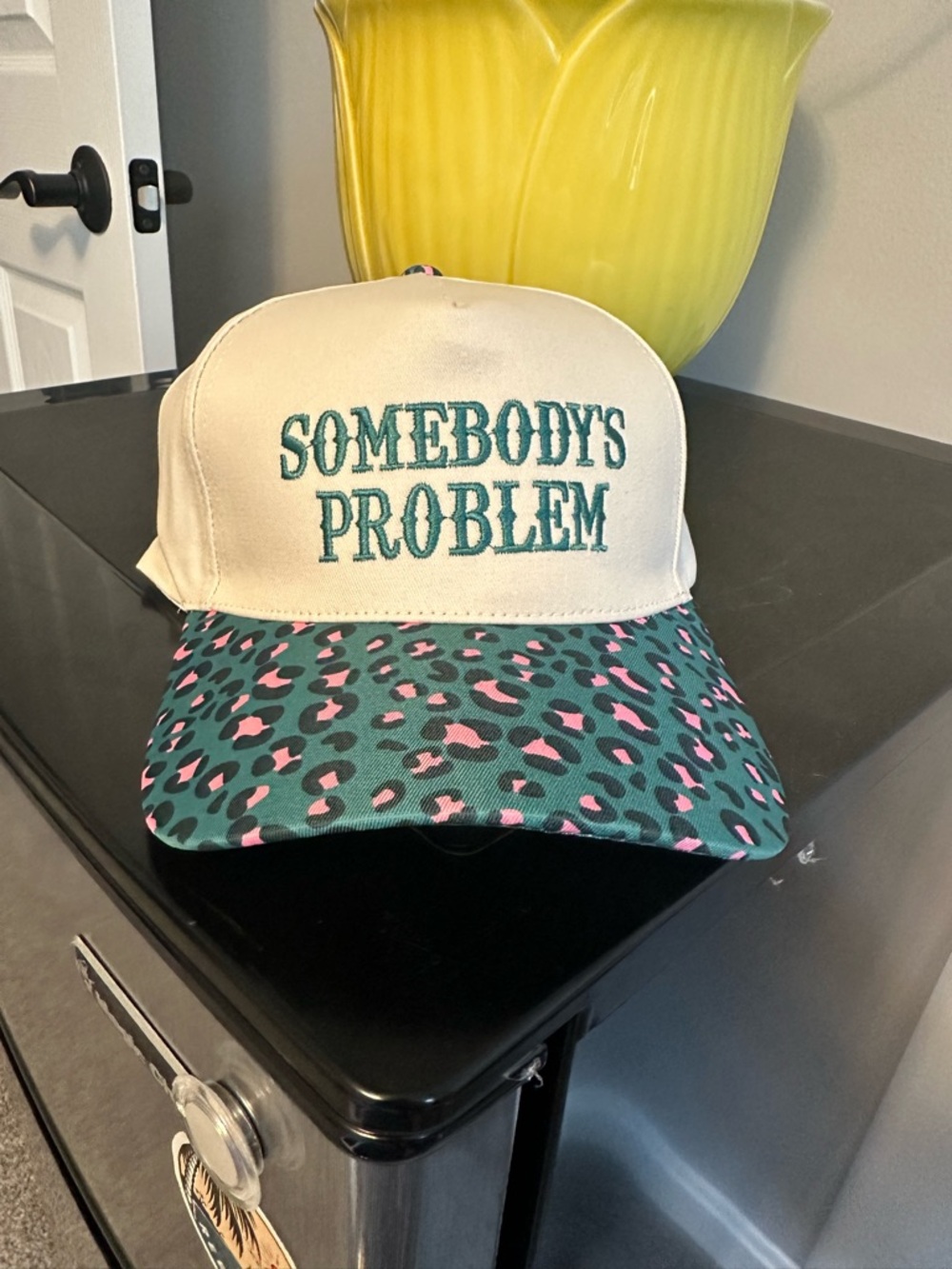 Somebody's Problem Embroidered Trucker Hat with Teal & Pink Leopard Bill